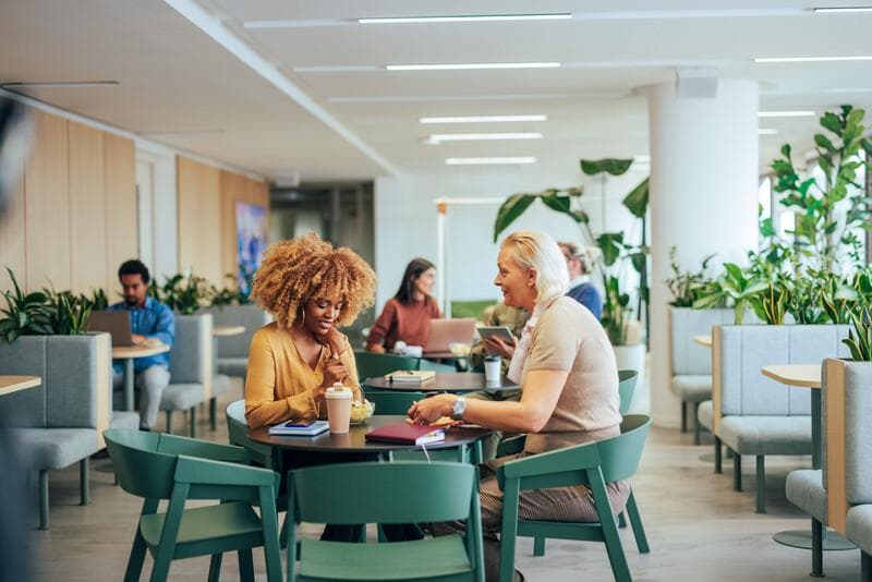 Coworkers enjoying lunch break at work.